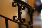 Detail of railing to an interior office space in 1075 Grand Concourse.
