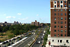 View up the Grand Concourse from 161st Street. In the foreground is the Concourse Plaza.